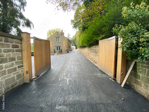 asphalt driveway at a old stone house 