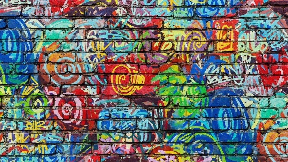 Obraz premium Vibrant graffiti-covered brick wall: a chaotic symphony of color and urban artistry