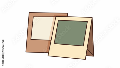 Two blank polaroid photos standing upright on a plain white background with brown borders.