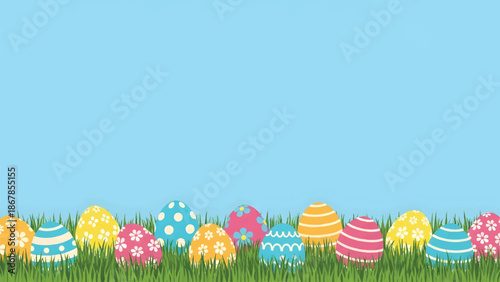 Colorful Easter eggs nestled in vibrant green grass celebrating spring and holiday joy.