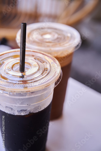 Photography Traditional Nanyang kopi-o (black coffee) and coffee with milk served in plastic takeaway cups at a kopitiam in Malaysia