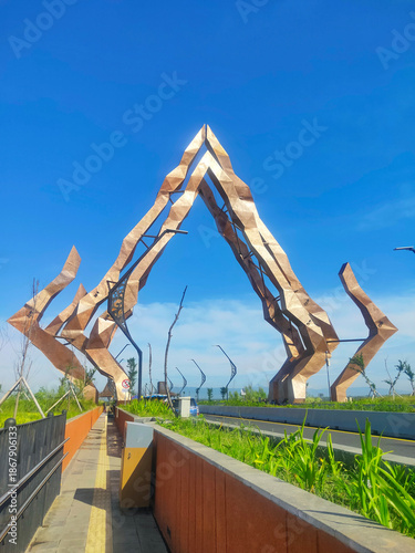 Kabanaran Bridge connects Kulon Progo and Bantul on Java’s Southern Cross Road, featuring a central gunungan-style gateway that reflects Javanese culture and local identity