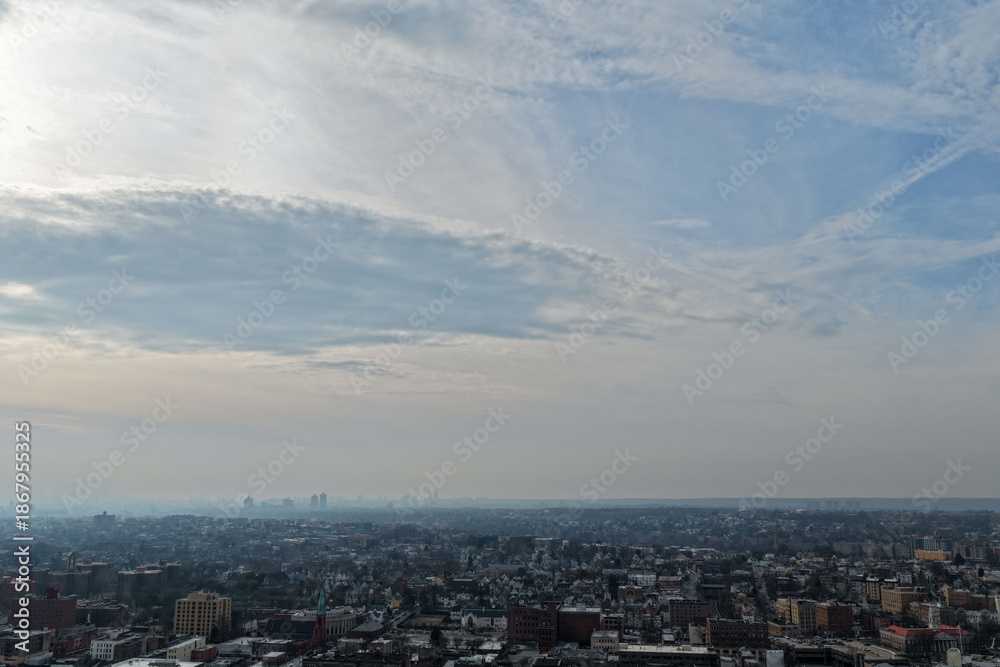 Fototapeta premium Foggy aerial drone photo of Mount Vernon New York with overcast winter sky and dense neighborhoods, image 20