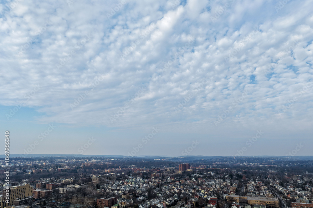Fototapeta premium Foggy aerial drone photo of Mount Vernon New York with overcast winter sky and dense neighborhoods, image 24