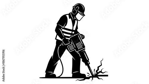 Construction worker operating jackhammer on site with safety gear