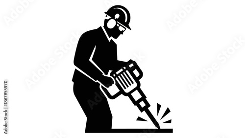 Construction worker operating jackhammer on site