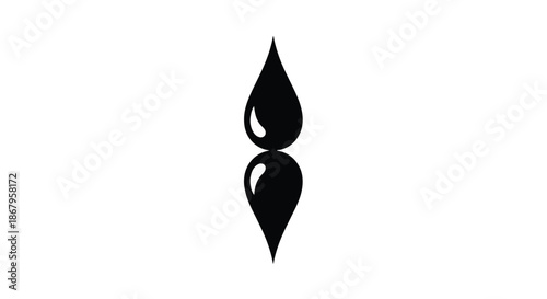 Symmetrical black ink drops creating a mirrored effect on a clean white background