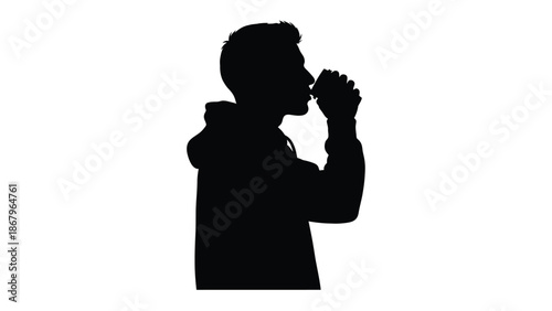 Silhouette of a young man wearing a hooded sweatshirt taking a drink from a small cup or can against a stark white background illustrating refreshment or break time