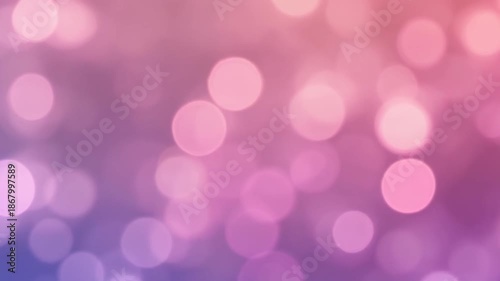 Soft pink and purple bokeh lights creating a dreamy, abstract background with blurred circular shapes.