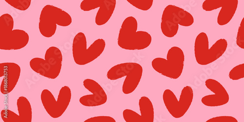 Seamless pattern of red hand drawn romantic hearts on a pink background. Design elements for Valentine's Day. Vector illustration