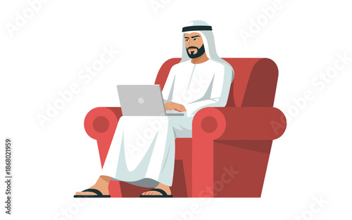 Man sitting on a red sofa using a laptop in a relaxed environment
