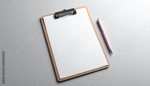 Blank white sheet of paper on a rustic wooden clipboard and pink pen isolated on a solid light gray background top view flat lay stationery mockup for presentation space to text. copy text.