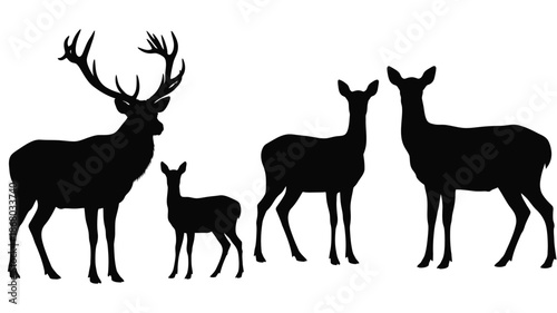 A family of deer stands together in a striking black silhouette