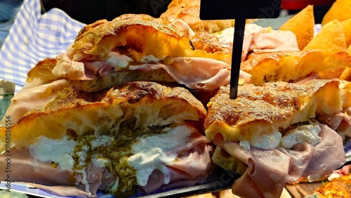 Photos Close up of delicious Mortadella sandwiches with stracciatella cheese and pistac
