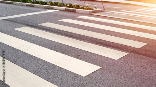 Slika na platnu Crosswalk with painted lines on asphalt pavement