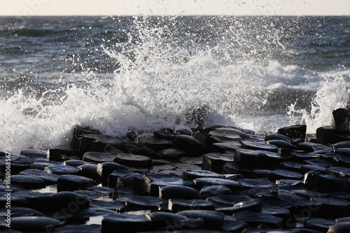 Waves crashing on basalt columns of Giant's Causeway, Northern Ireland