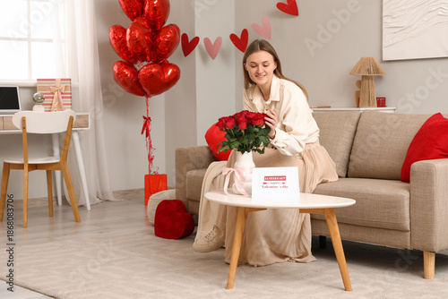 Young woman with red roses ...