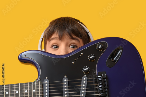 Cute boy in headphones with...