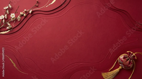 Elegant red textured background with decorative wavy lines and delicate white plum blossoms and a traditional chinese lucky charm pouch with golden tassels