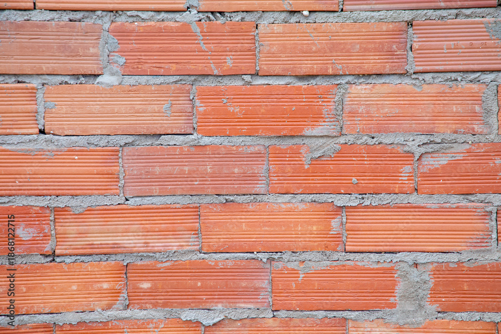 Fototapeta premium pattern of red rough brick wall