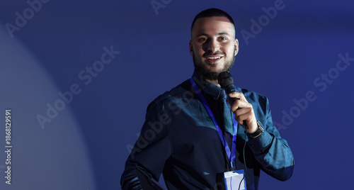 Young business speaker cond...