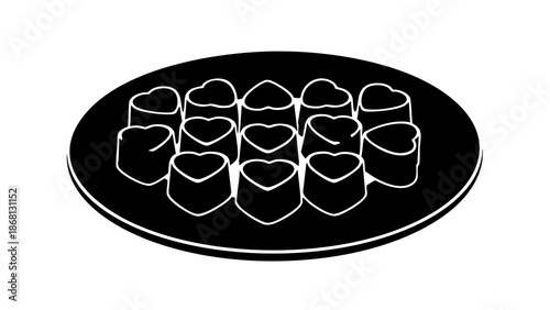 A collection of heart-shaped chocolates displayed on a plate. The chocolates are arranged in an appealing pattern, conveying sweetness and indulgence
