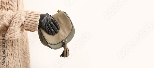 Woman in black leather glov...