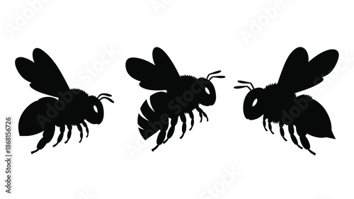 Three black bees in flight a striking graphic silhouette
