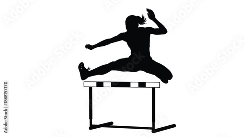 Athlete jumping over hurdle in a striking black silhouette
