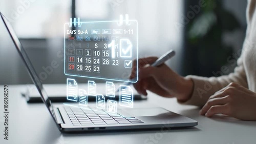 Professional scheduling tasks and managing digital documents on a laptop with a virtual holographic calendar and digital pen. Concept of future technology, AI, productivity, and smart office...