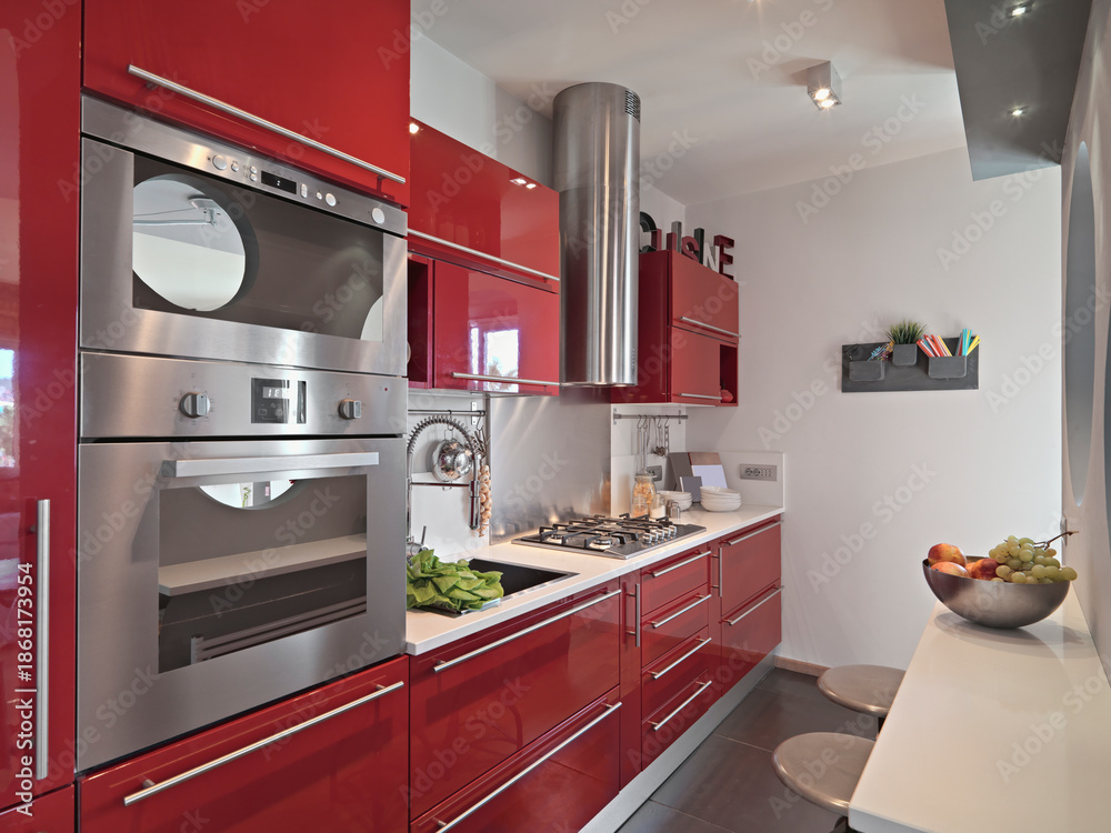 custom made wallpaper toronto digitalInterior view of a modern red lacquered kitchen, with built-in ovens in the foreground.