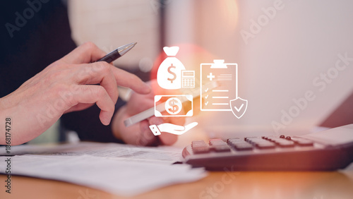 Man using calculator to calculating balance prepare tax reduction income and holding smartphone calculating cost budget expenses pay money form personal Individual Income Tax Return
