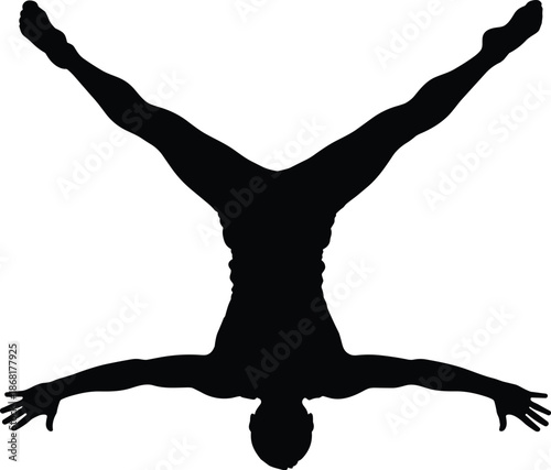 Black Silhouette of Athletic Man Performing a Straddle Handstand Against White Background Highlighting Strength Balance Gymnastics Fitness and Artistic Body Movement (Exactly 20 words)