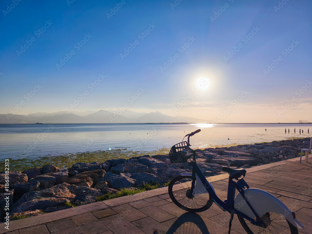Fototapeta premium Bicycle by the Sea with Wide Coastal View on a Sunny Day