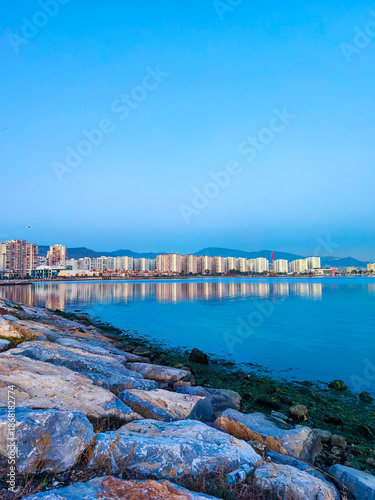Wallpaper Mural Coastal City Skyline with Calm Sea and Waterfront at Blue Hour Torontodigital.ca