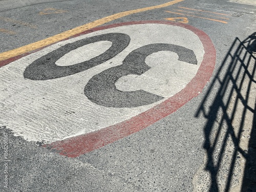 Traffic signs on the road surface, a minimum speed requirement.