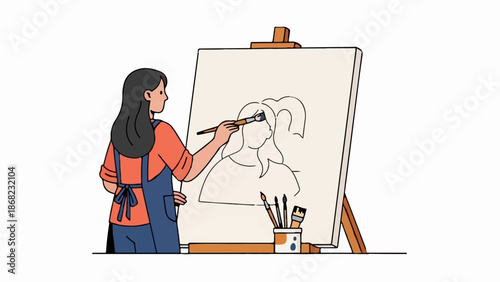 Artist painting portrait on canvas easel with brushes and apron