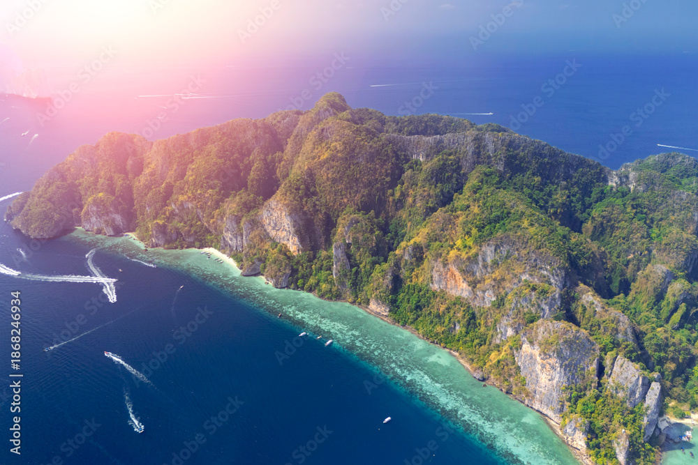 Fototapeta premium Magical paradise islands with rocks jungle forest on the coast of atoll coral reefs in Andaman Sea view Krabi from above aerial top view drone travel