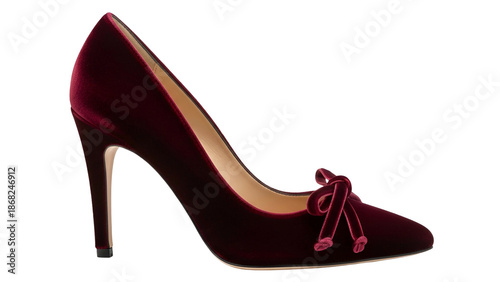 A high-heeled shoe, in dark red velvet, featuring a bow, on a black background