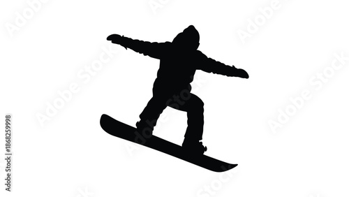 Silhouette of a snowboarder in mid air performing a trick on the snow