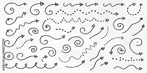 Collection of hand drawn arrows swirls and dotted lines on lined paper