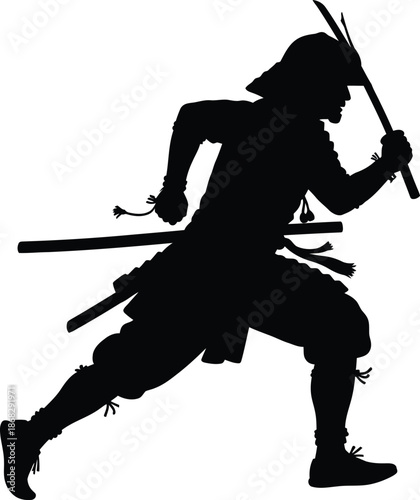 Silhouette of a samurai warrior in a dynamic fighting pose with swords