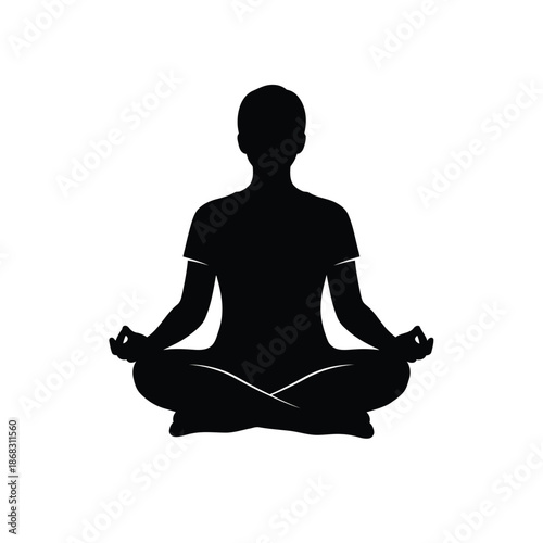 Silhouette of a person meditating in a lotus position