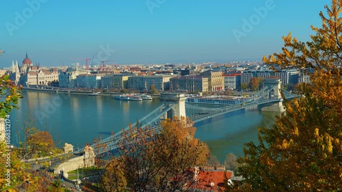 Panoramic view of Budapest and Danube River, city architecture, bridges and road traffic
