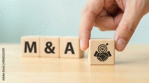 Wooden blocks spelling M and A with fingerprint icon on desk, mergers and acquisitions strategy, business deal and corporate identity concept

