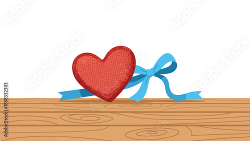 A textured red heart with a blue ribbon lies on a wooden surface, representing love, gifting, and heartfelt sentiment.