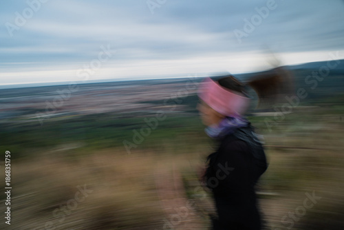 Mountain runner running outdoors with motion blur