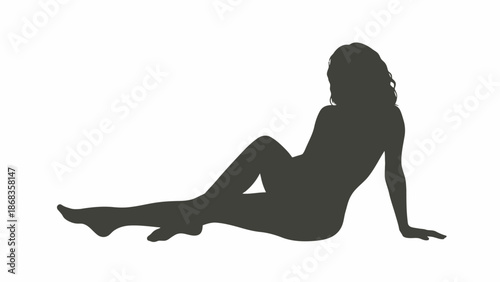 Silhouette of a woman reclining on a white background, elegantly posed and captured in a dark, stark outline