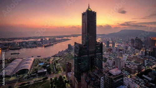 Aerial view of Kaohsiung 85 Sky Tower and Kaohsiung Harbor at sunset, Taiwan cityscape.