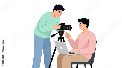 Two men filming with a camera and laptop